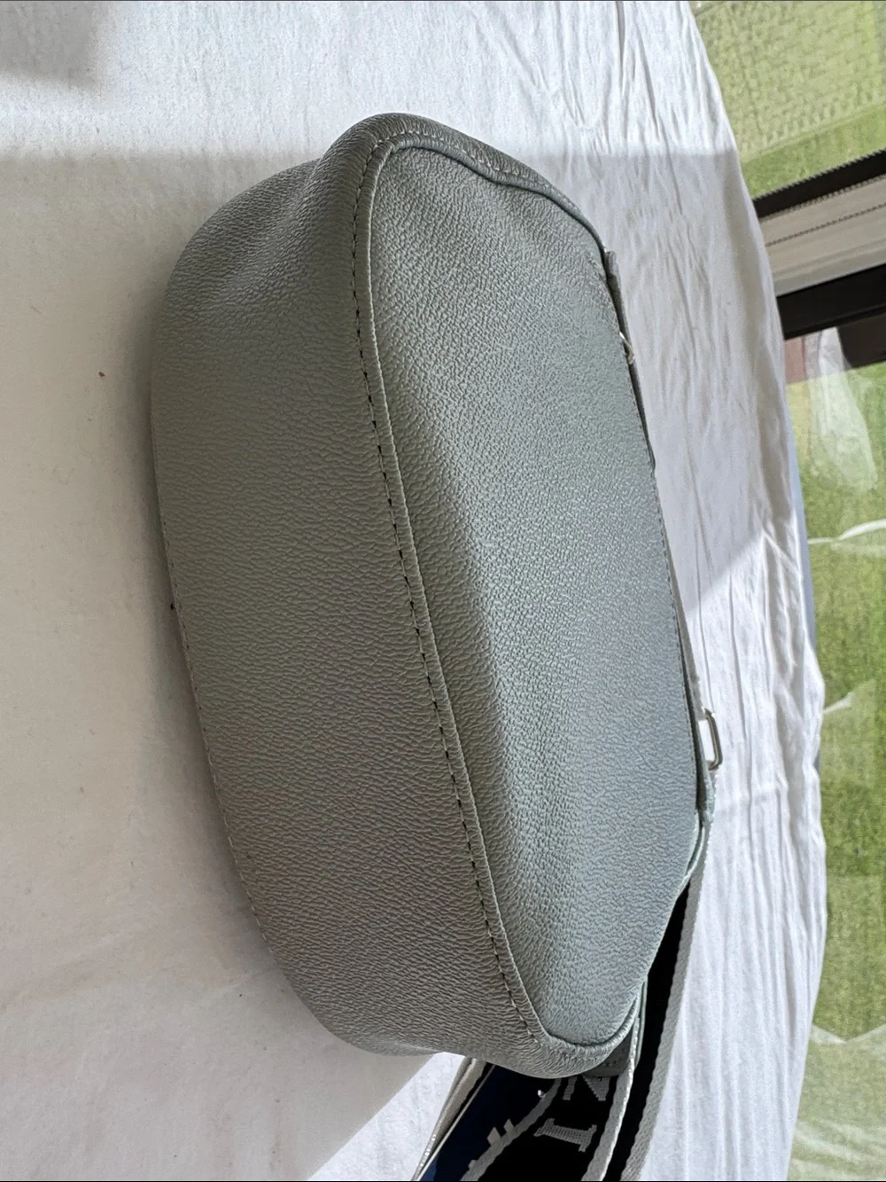 Izod Sage Pebbled Saddle Crossbody with Branded Strap